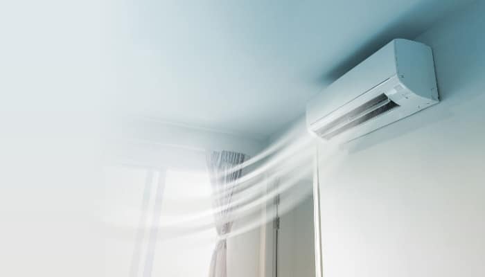 Ductless Air Conditioner On Blue Wall